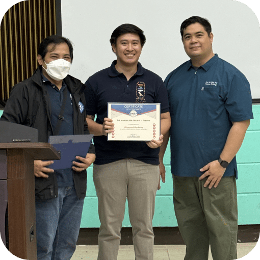 Veterinarian holding a certificate from training.